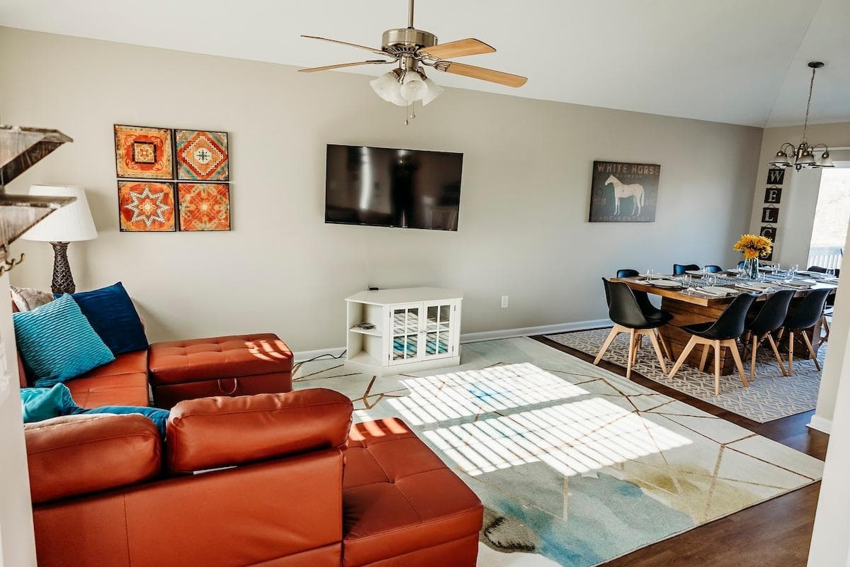 When you walk in the door, you are in the first of two living areas, which includes living room, dining room and kitchen with vaulted ceilings and tasteful modern decor.  
